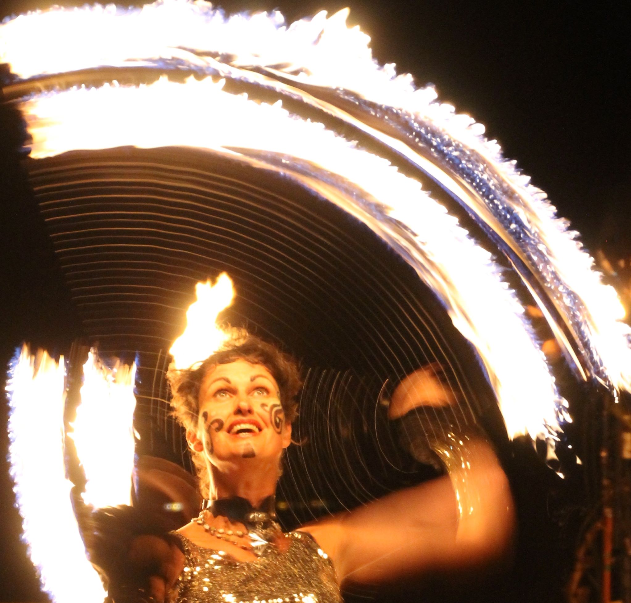 I love to perform with fire. My fire crown and fingers (both self made) are favourites but here I'm spinning poi.