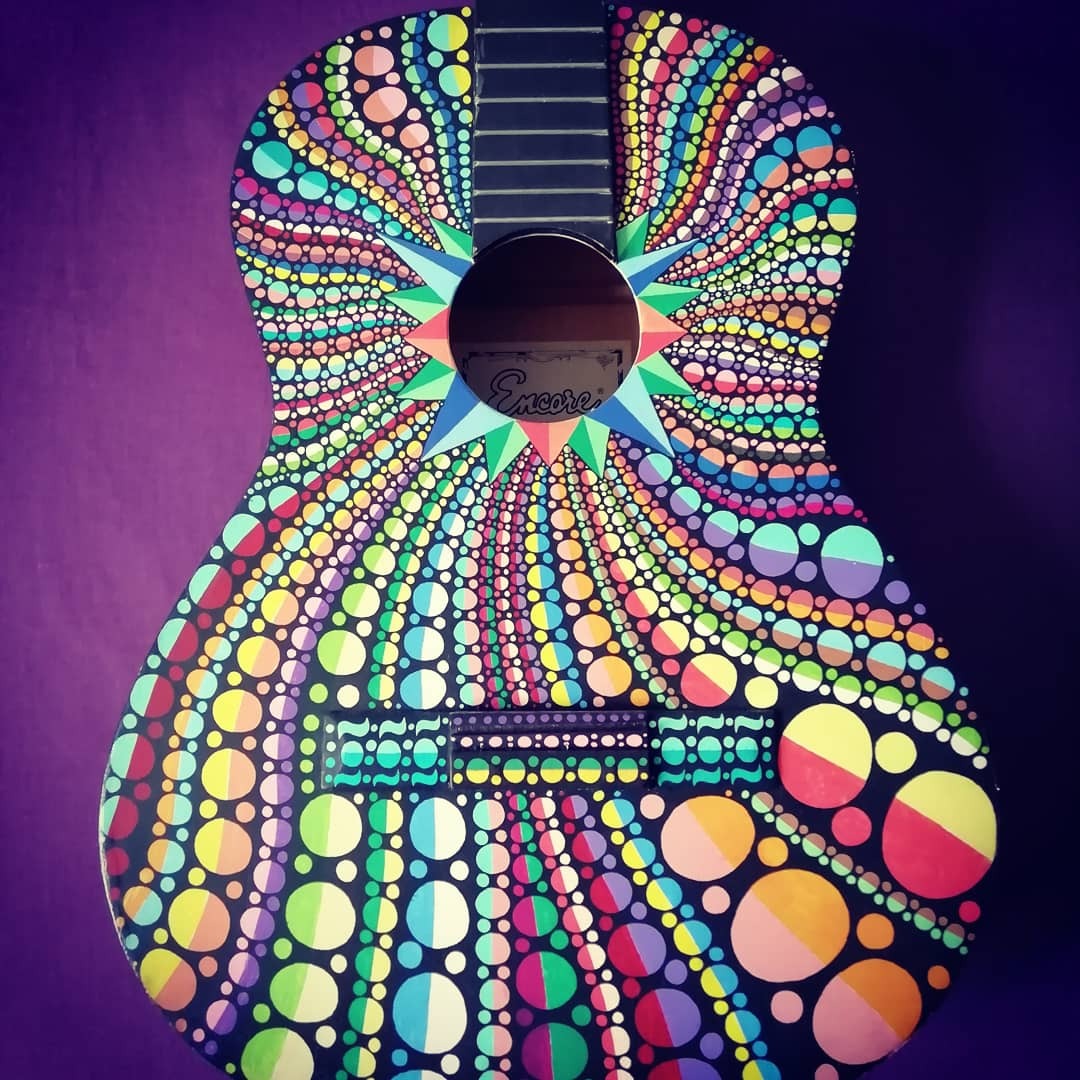Acoustic guitar hand painted with paint pens. Very interested in exhibiting / performance with completed instruments and creating more on unique / better quality products 