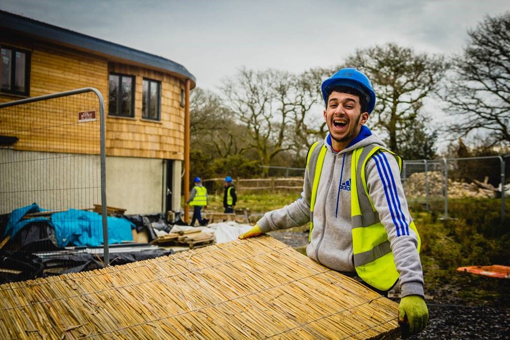 Smiles while building the Residential Centre