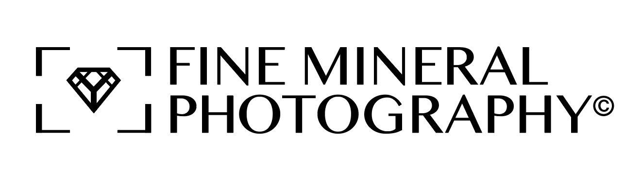 Logo design for a company named Fine Mineral Photography. The logomark is a crystal within a camera viewfinder 