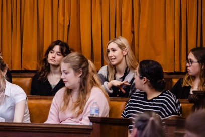 An image of students talking at an event