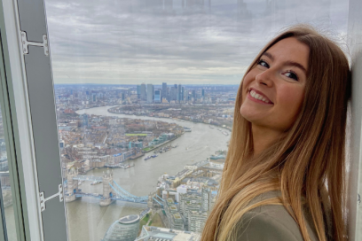 Picture of Ffion standing in front of tall buildings in London